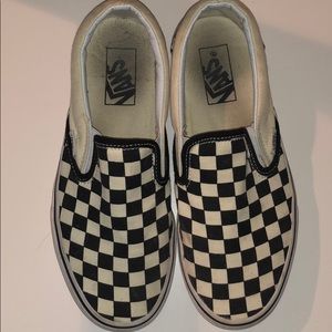 Black checkerboard slip on vans